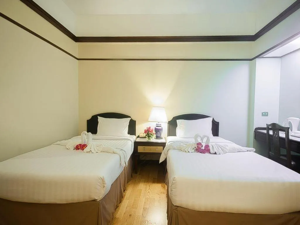 Bed in Grand Plaza Hotel