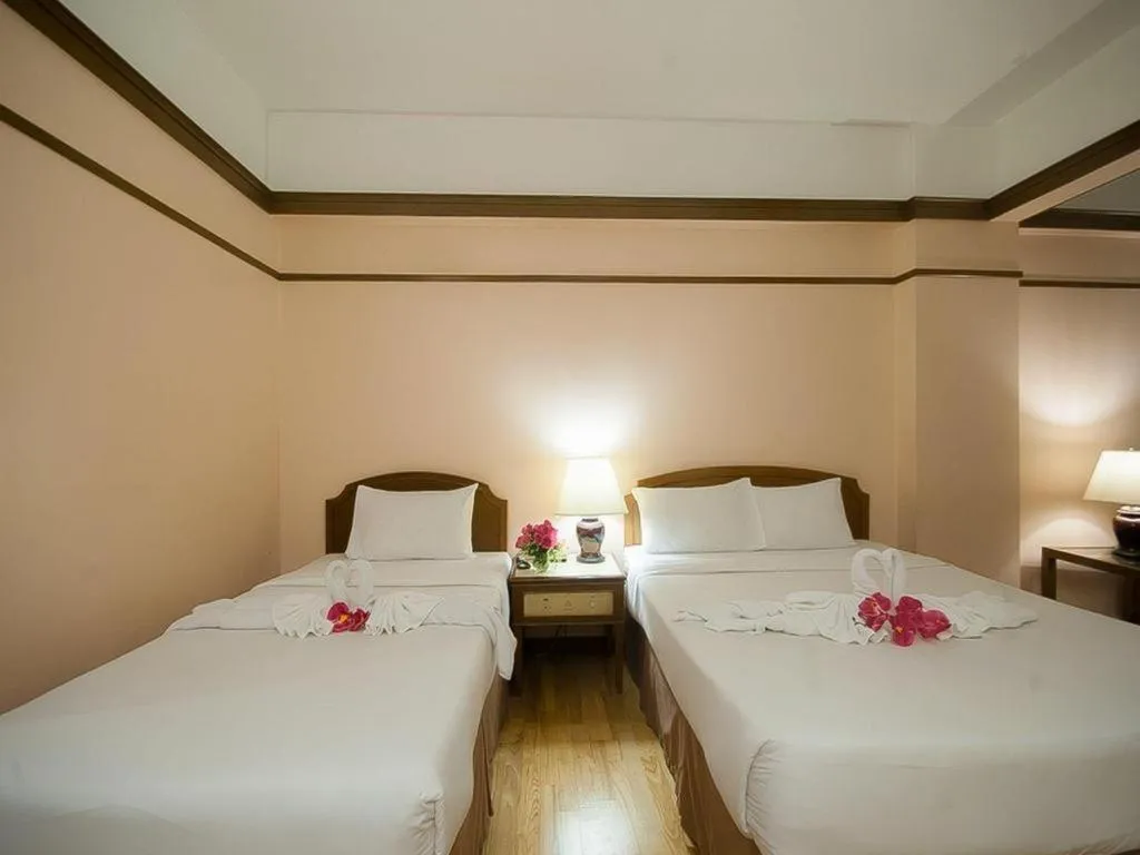 Bed in Grand Plaza Hotel