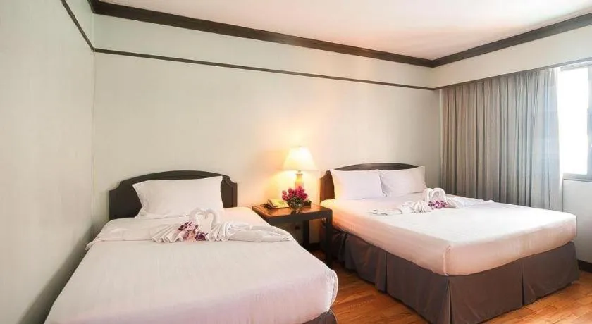 Bed in Grand Plaza Hotel