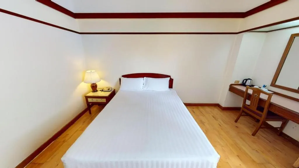 Bed in Grand Plaza Hotel