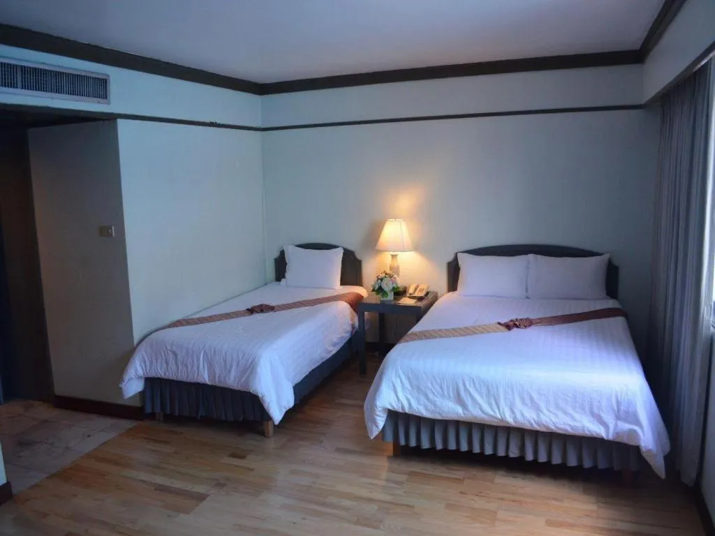 Bed in Grand Plaza Hotel