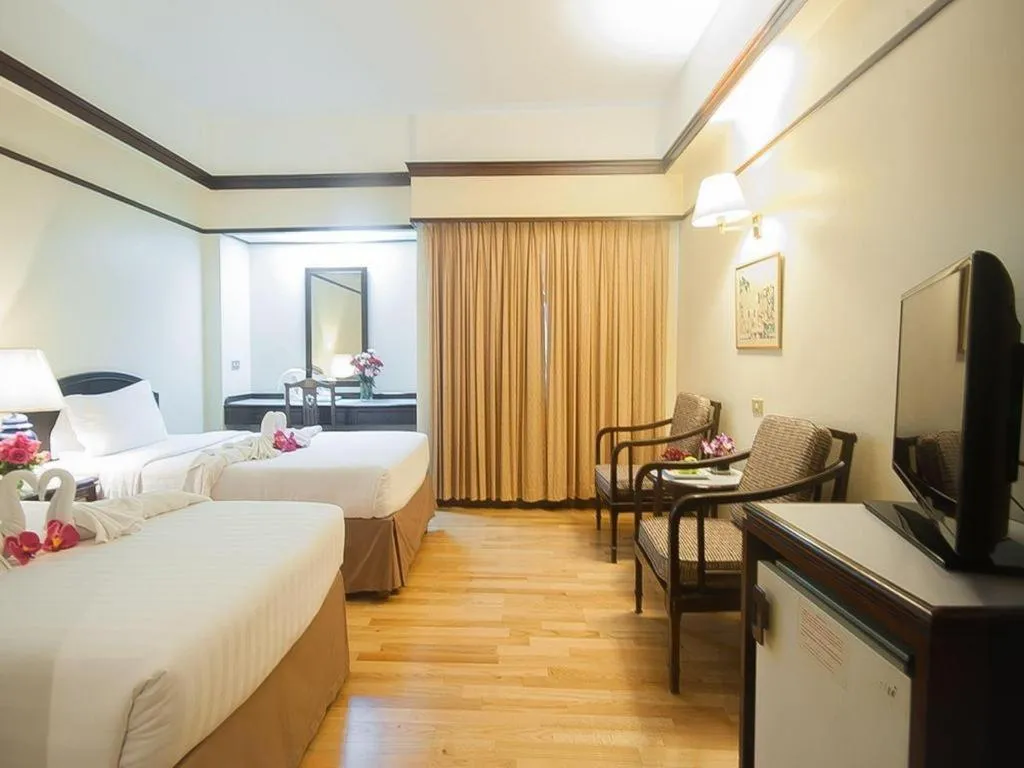 Bed in Grand Plaza Hotel