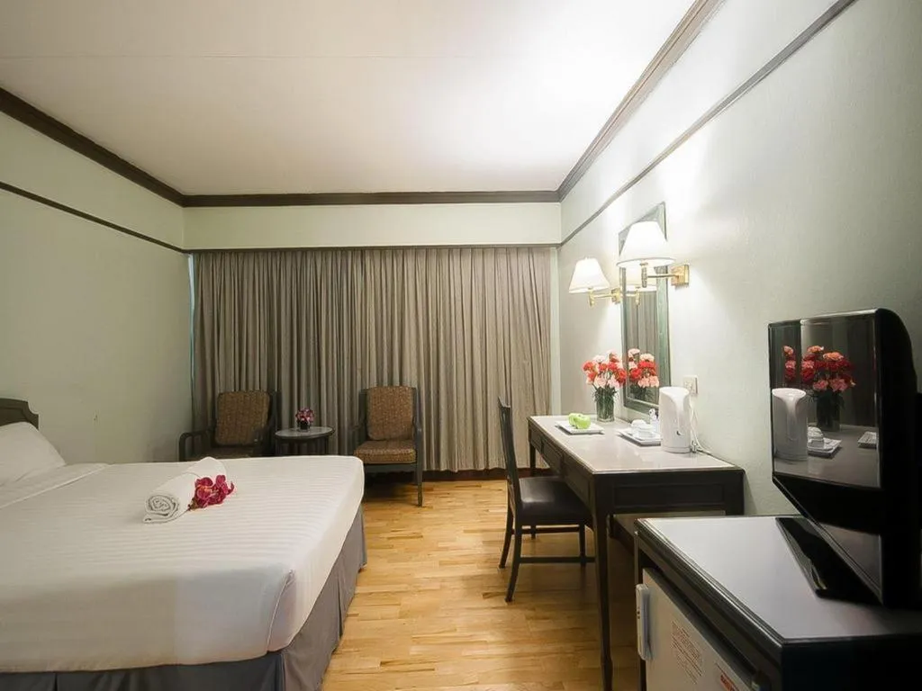 Bed in Grand Plaza Hotel