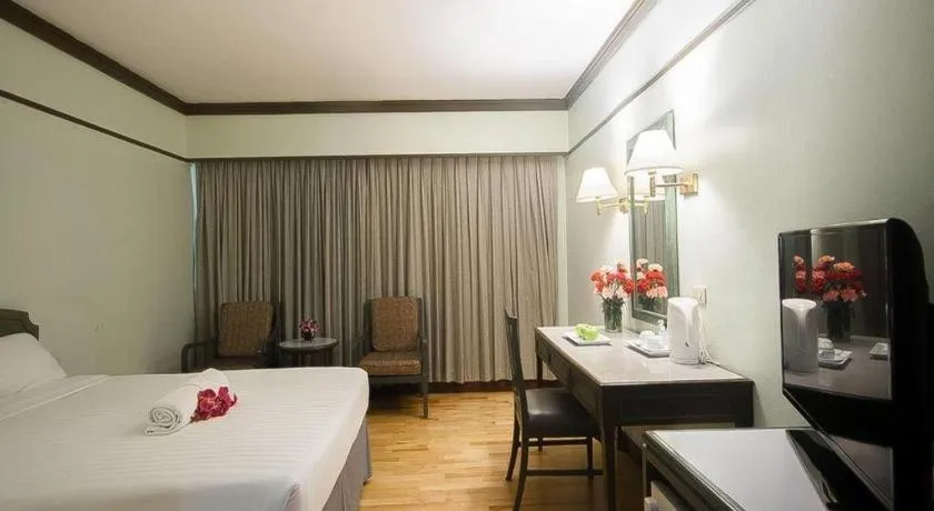 Bed in Grand Plaza Hotel