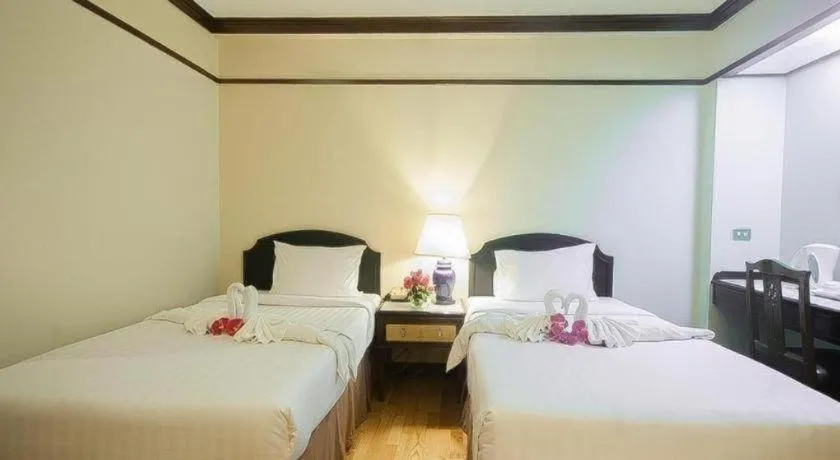 Bed in Grand Plaza Hotel