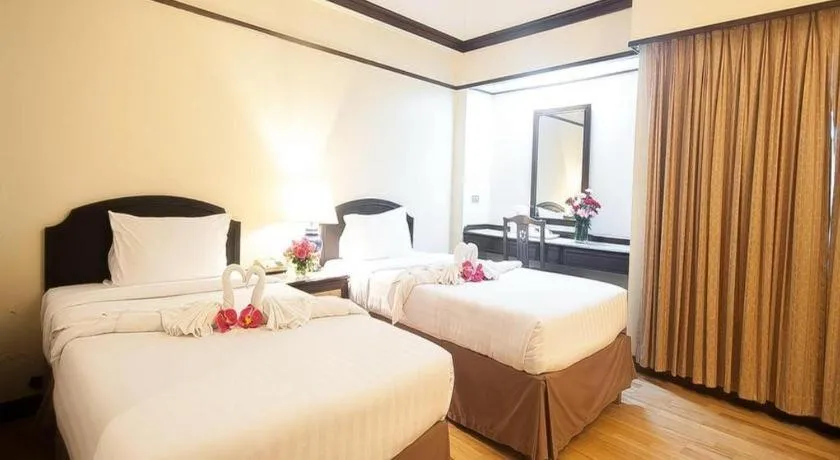 Bed in Grand Plaza Hotel