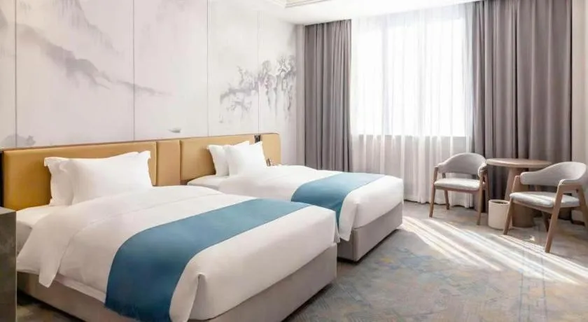 Bed in Nanning Yongjiang Hotel