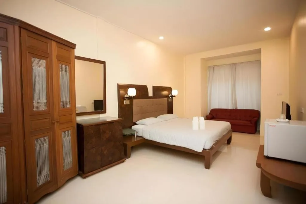 Bed in Lotusland Resort