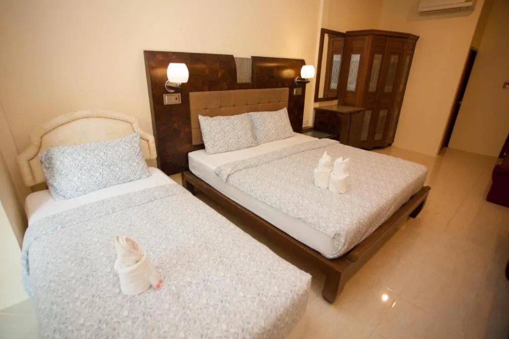 Bed in Lotusland Resort