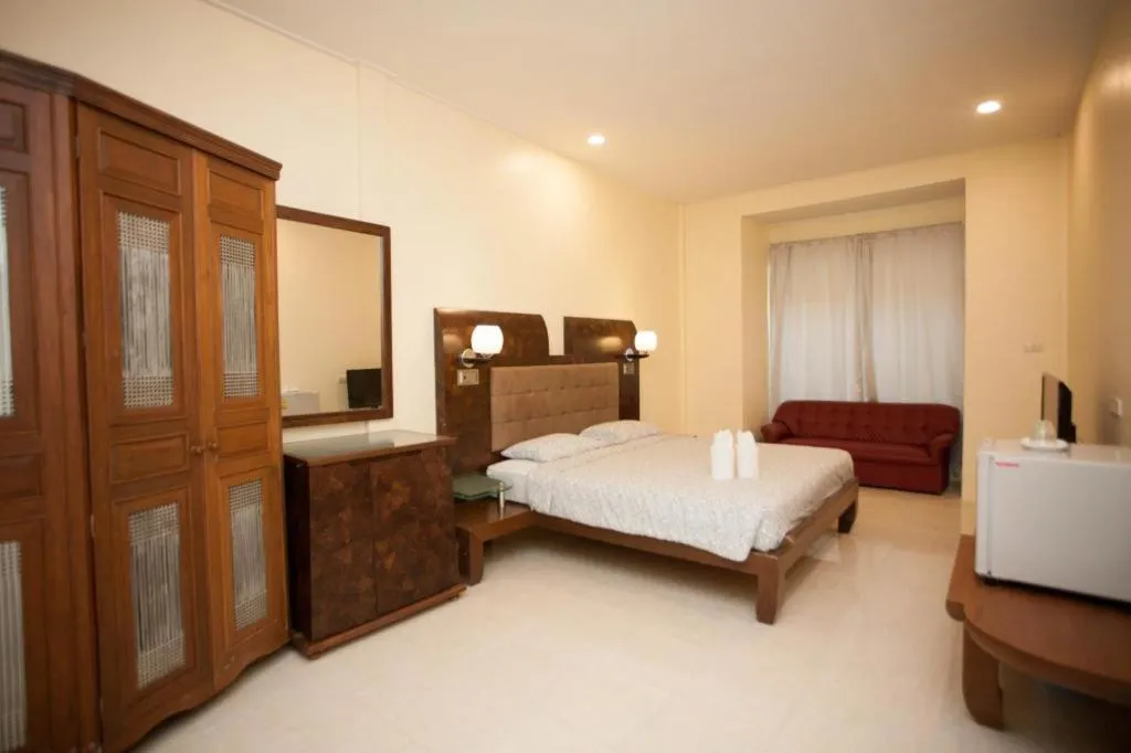 Bed in Lotusland Resort