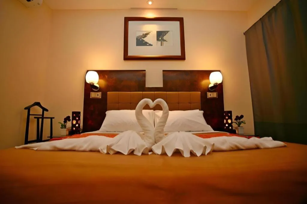 Bed in Lotusland Resort