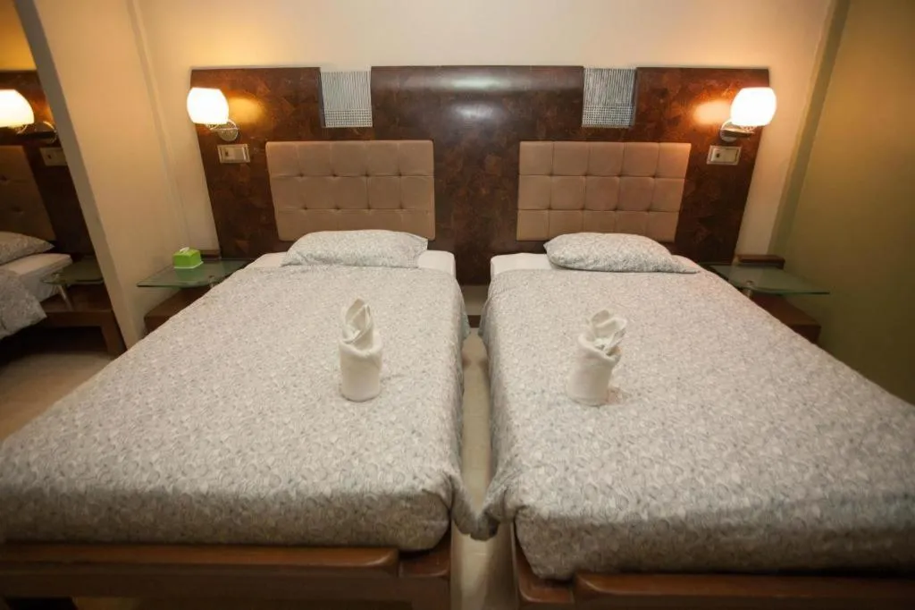 Bed in Lotusland Resort