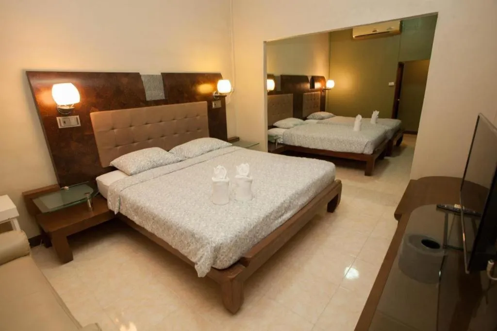 Bed in Lotusland Resort