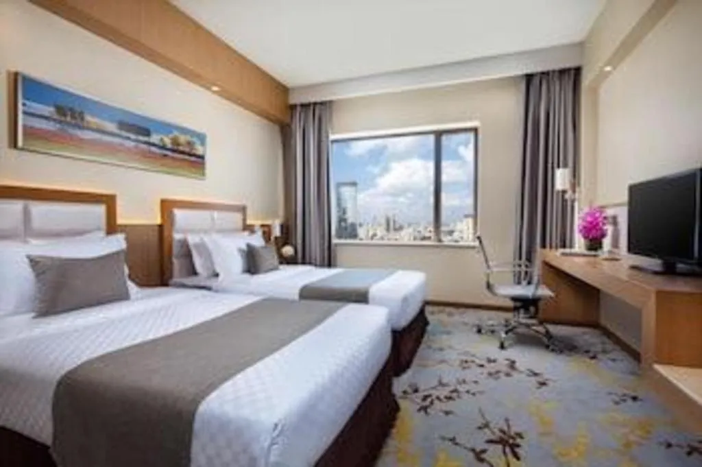 Bed in Kunming Jinjiang Hotel