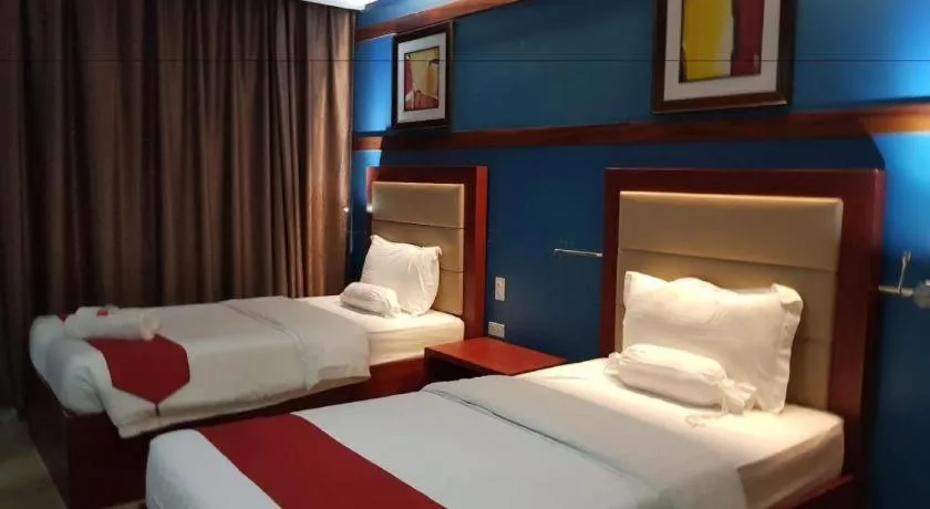 Bed in Cherry Midtown Hotel