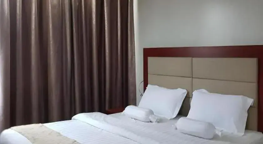 Bed in Cherry Midtown Hotel Bed in Cherry Midtown Hotel