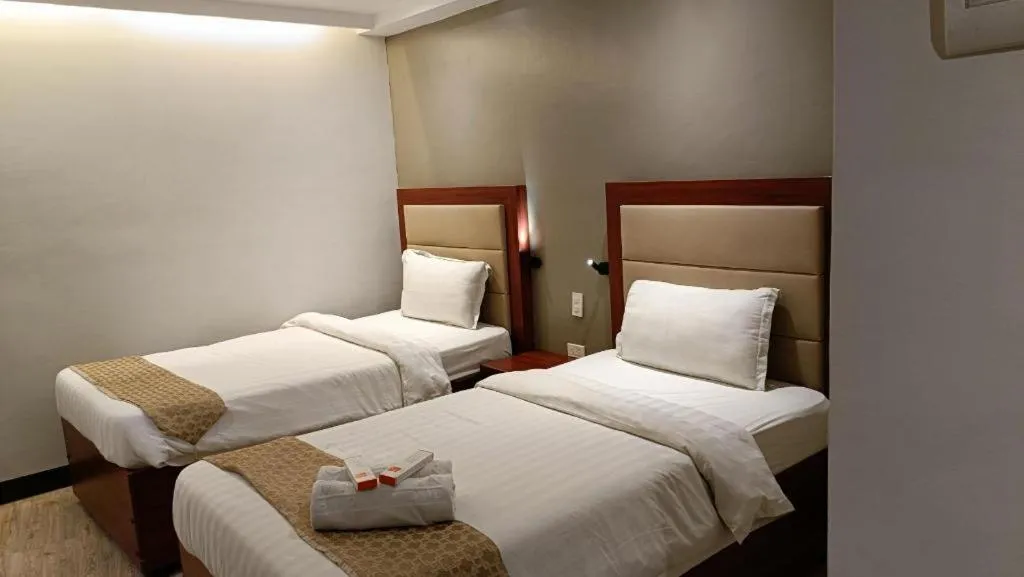 Bed in Cherry Midtown Hotel