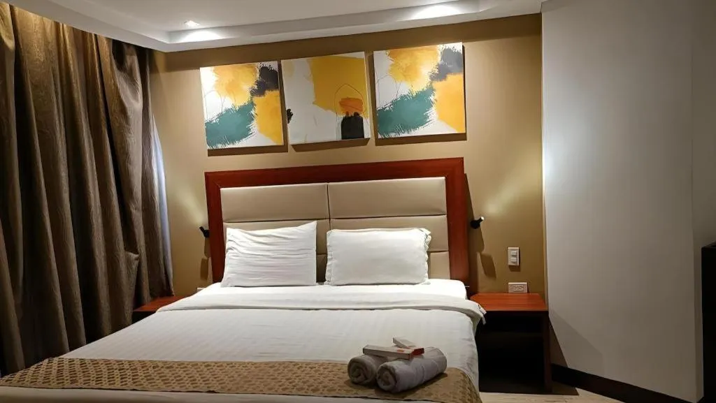 Bed in Cherry Midtown Hotel