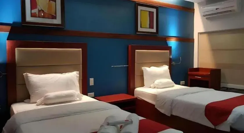 Bed in Cherry Midtown Hotel Bed in Cherry Midtown Hotel