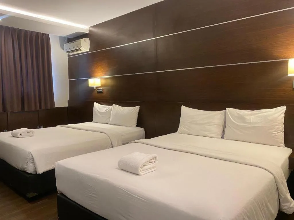 Bed in D'Season Premiere Hotel