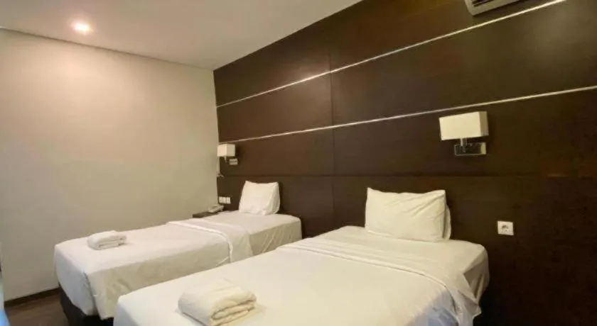 Bed in D'Season Premiere Hotel