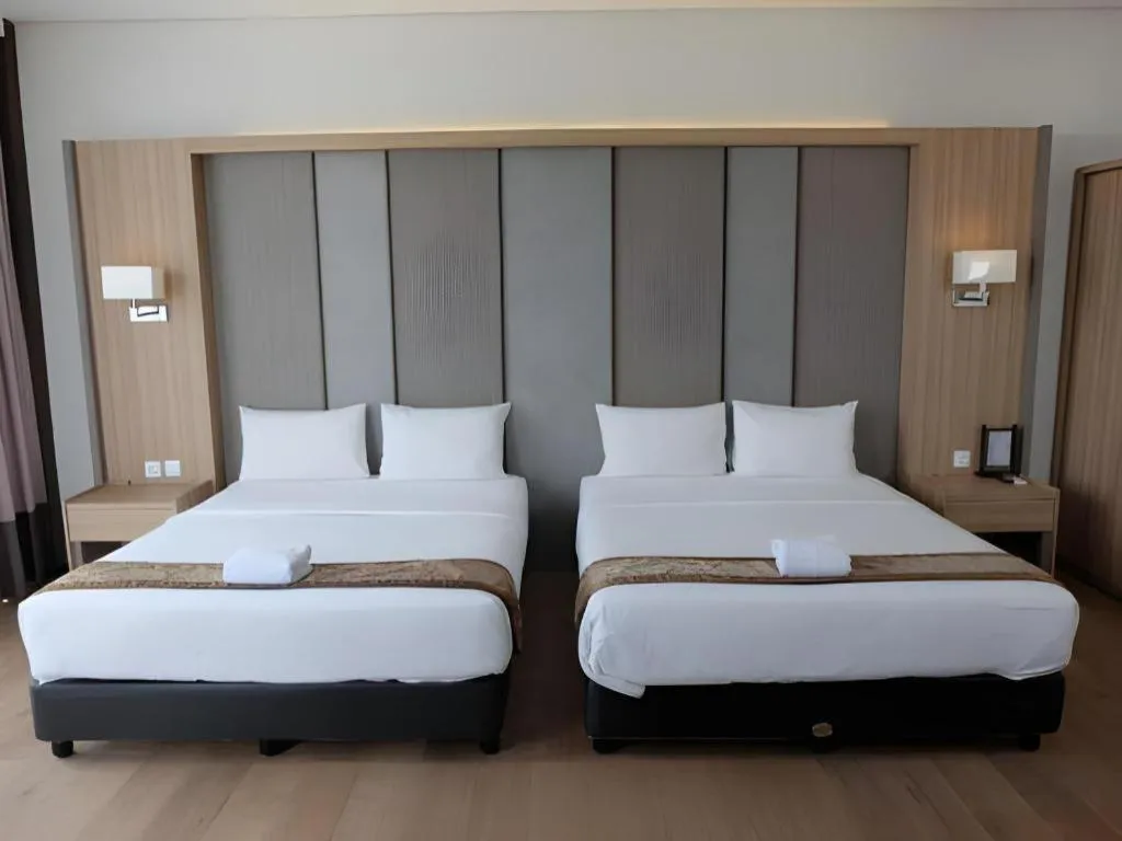 Bed in D'Season Premiere Hotel