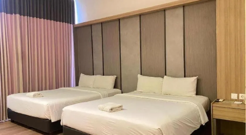 Bed in D'Season Premiere Hotel