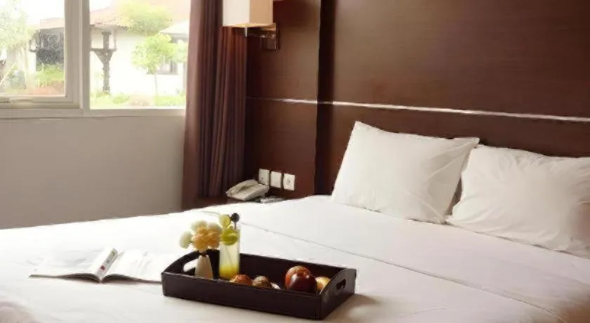 Bed in D'Season Premiere Hotel