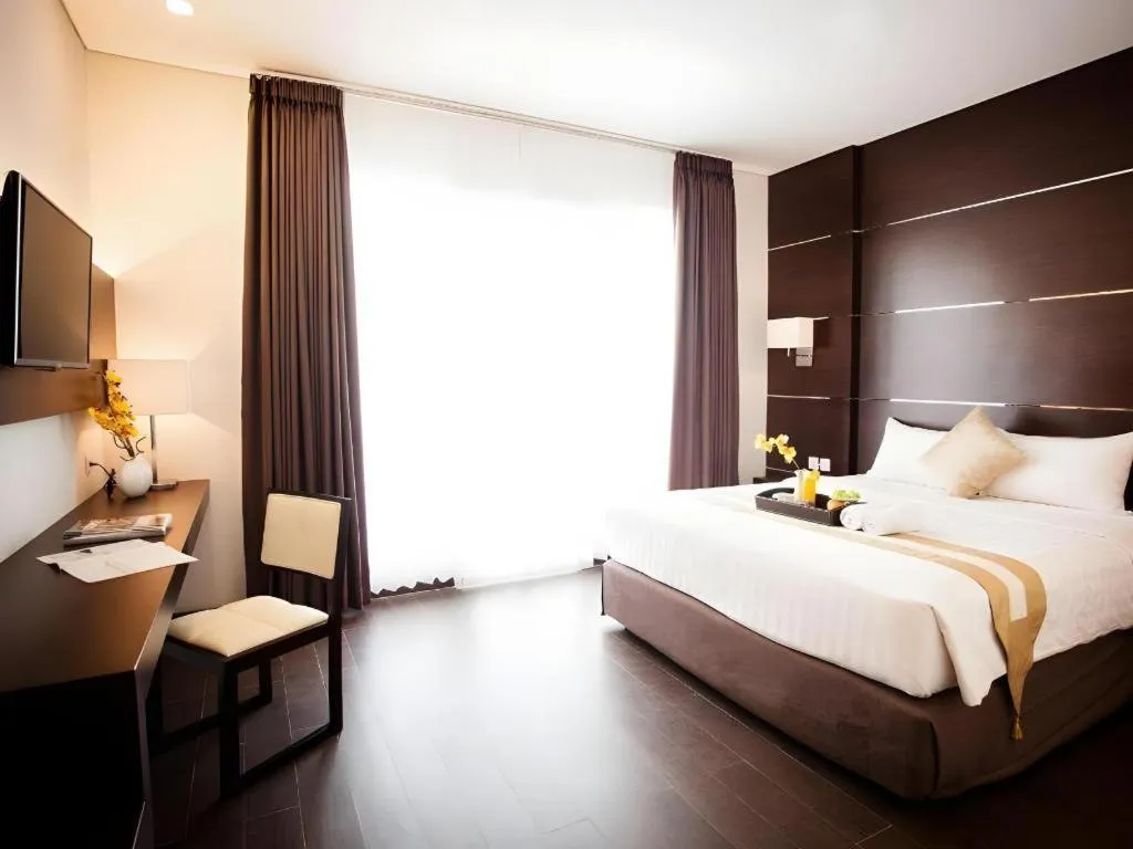 Bed in D'Season Premiere Hotel