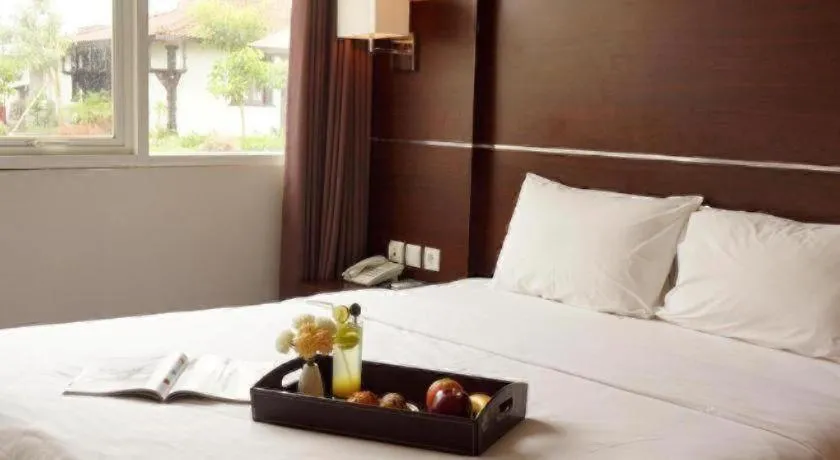 Bed in D'Season Premiere Hotel