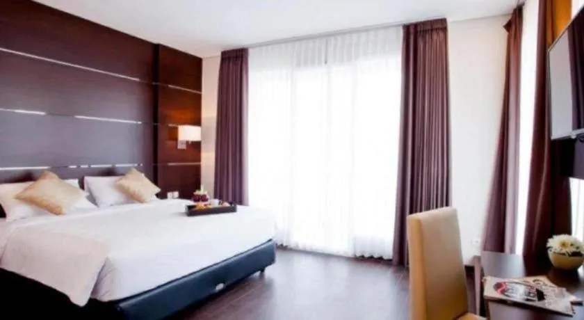 Bed in D'Season Premiere Hotel