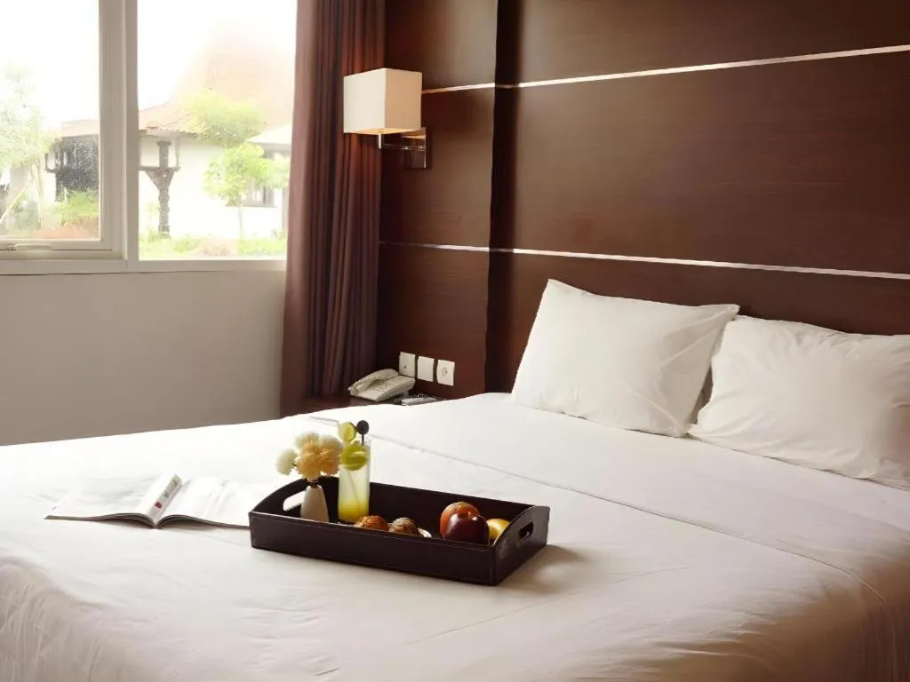 Bed in D'Season Premiere Hotel