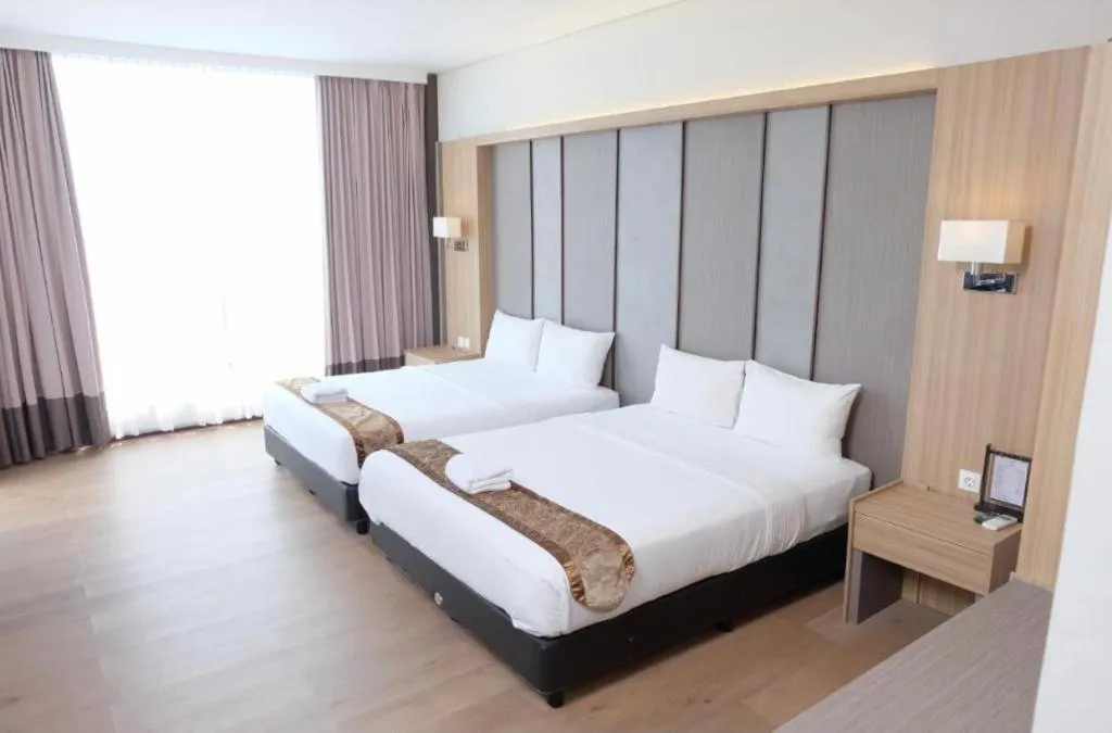 Bed in D'Season Premiere Hotel