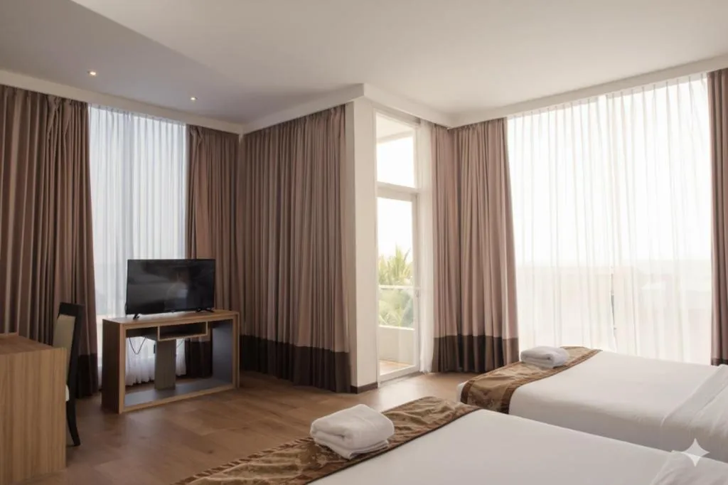 Bed in D'Season Premiere Hotel