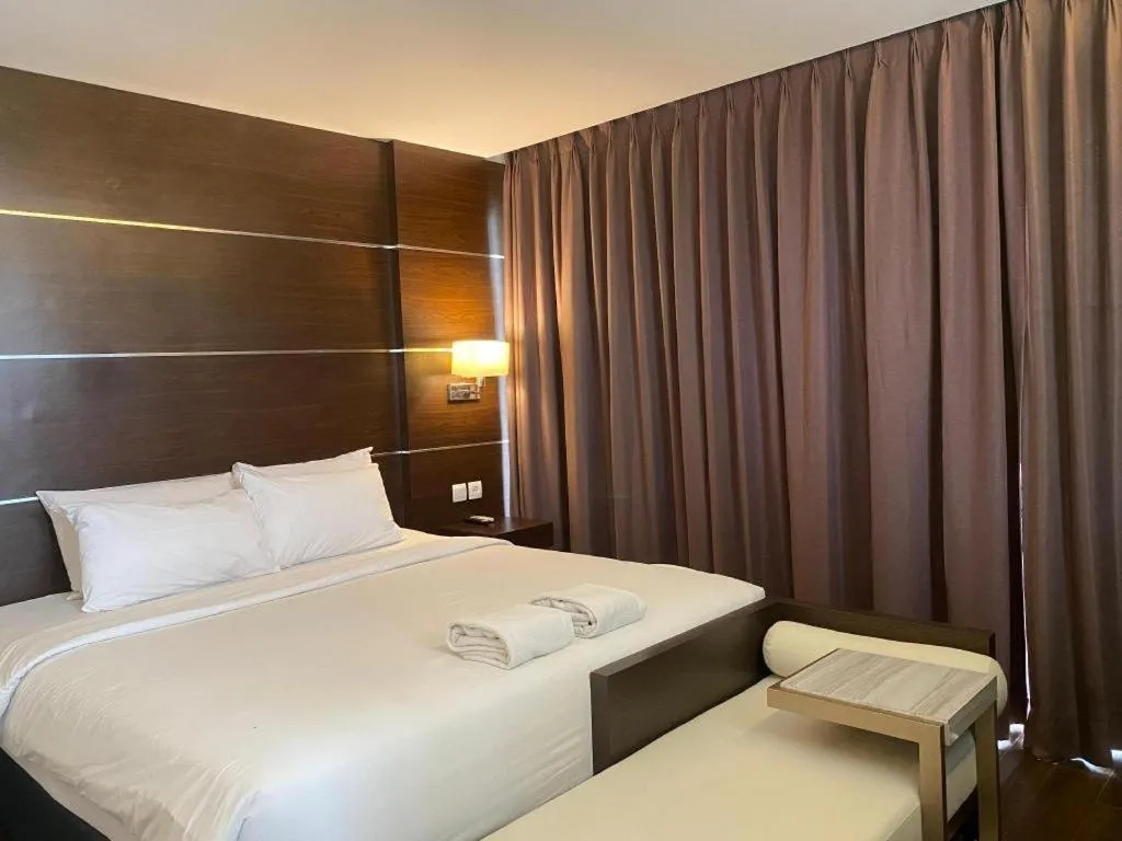 Bed in D'Season Premiere Hotel