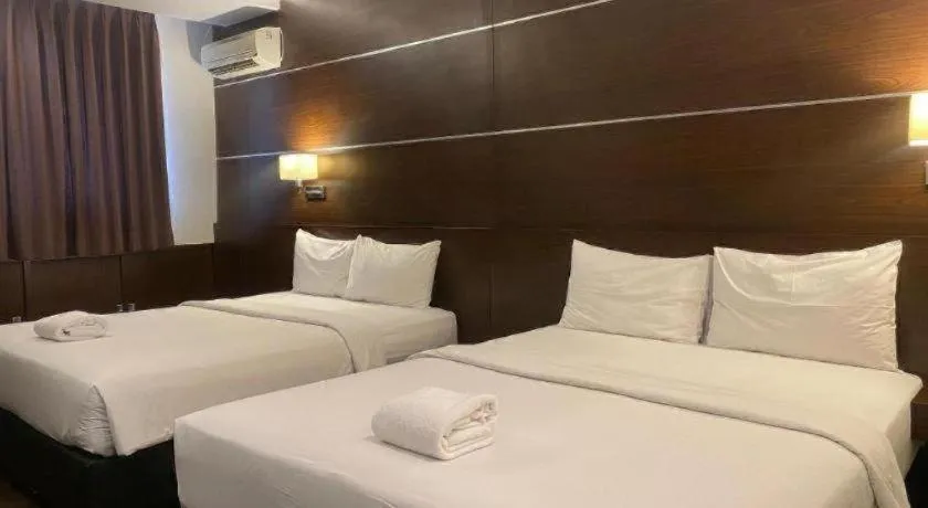 Bed in D'Season Premiere Hotel