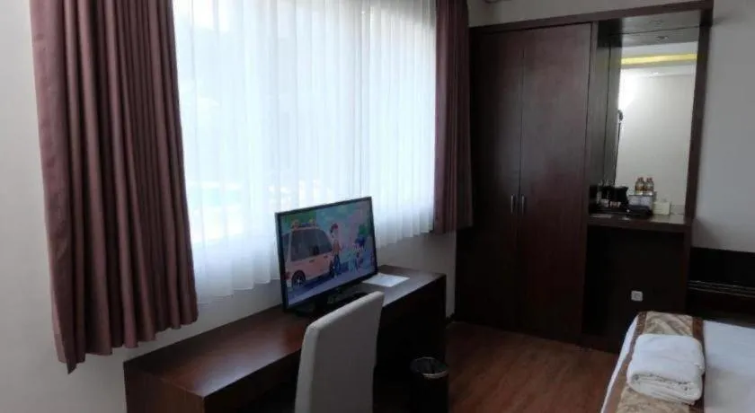 Bed in D'Season Premiere Hotel