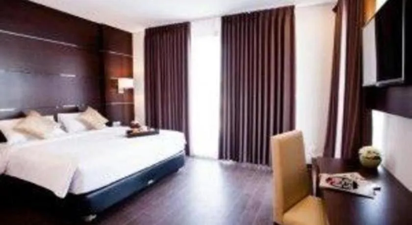 Bed in D'Season Premiere Hotel