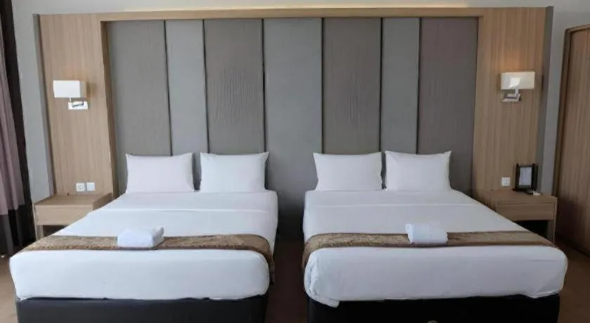 Bed in D'Season Premiere Hotel