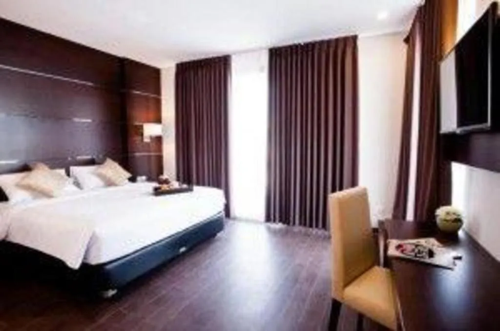 Bed in D'Season Premiere Hotel