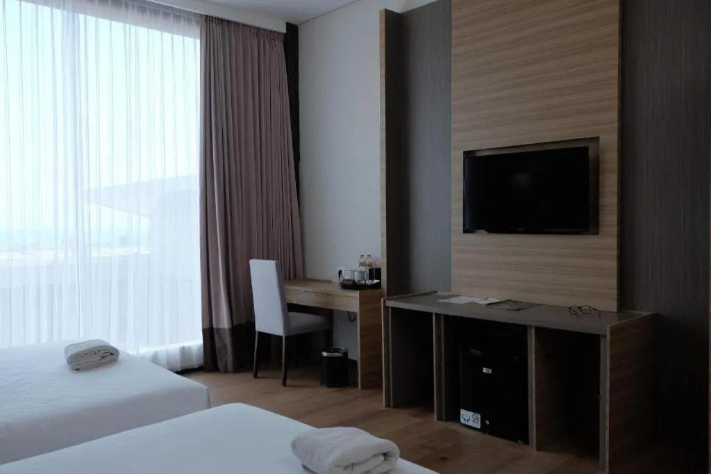 Bed in D'Season Premiere Hotel