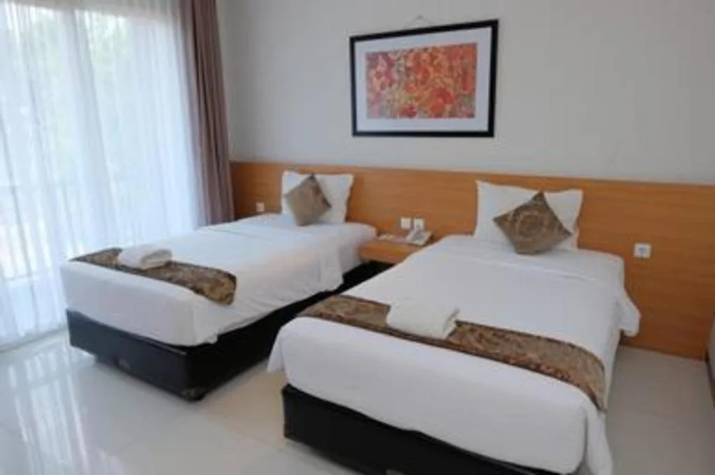 Bed in D'Season Premiere Hotel