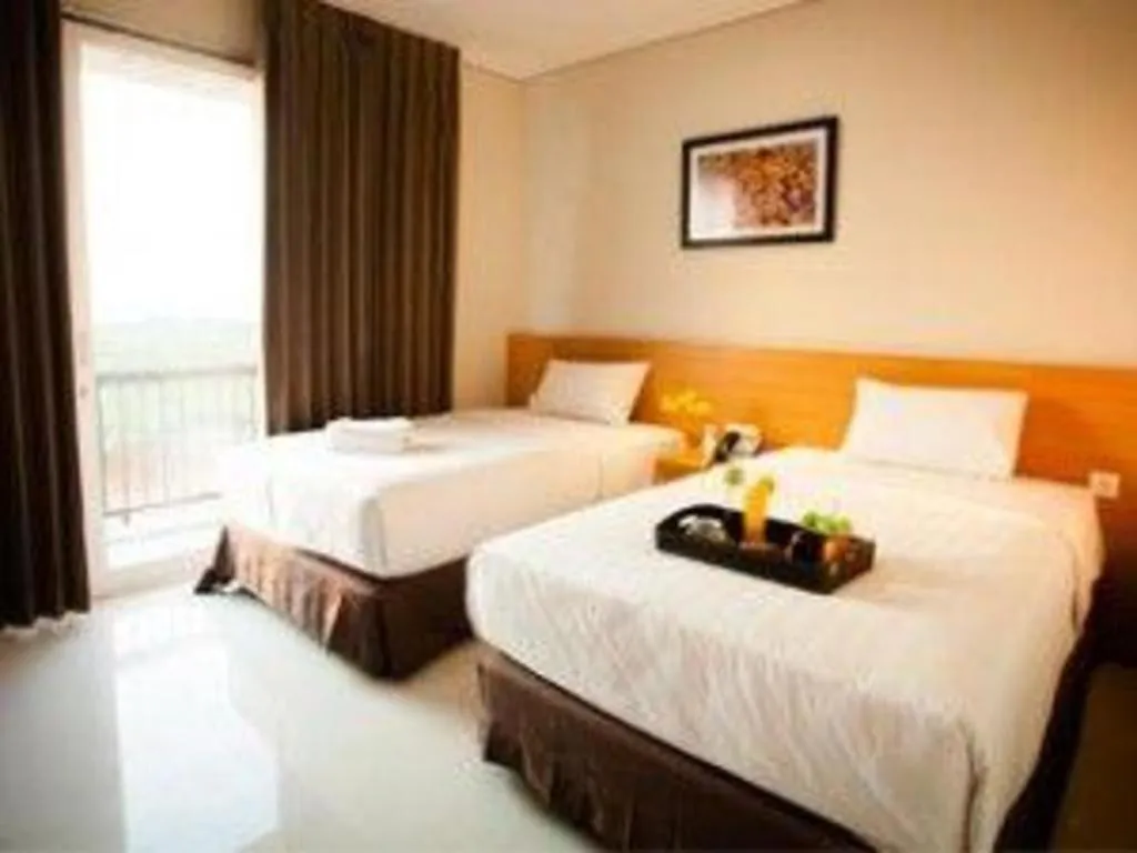 Bed in D'Season Premiere Hotel