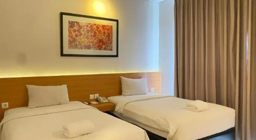 Bed in D'Season Premiere Hotel