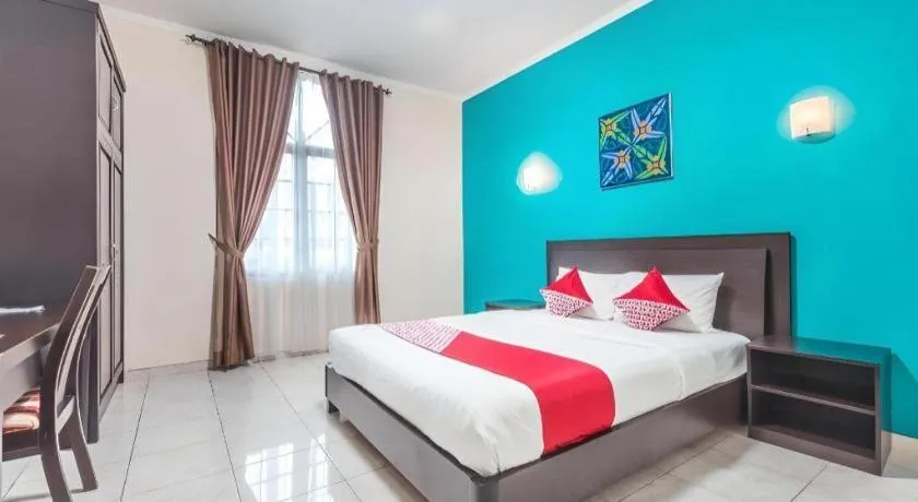 Bed in Ole Suite Hotel