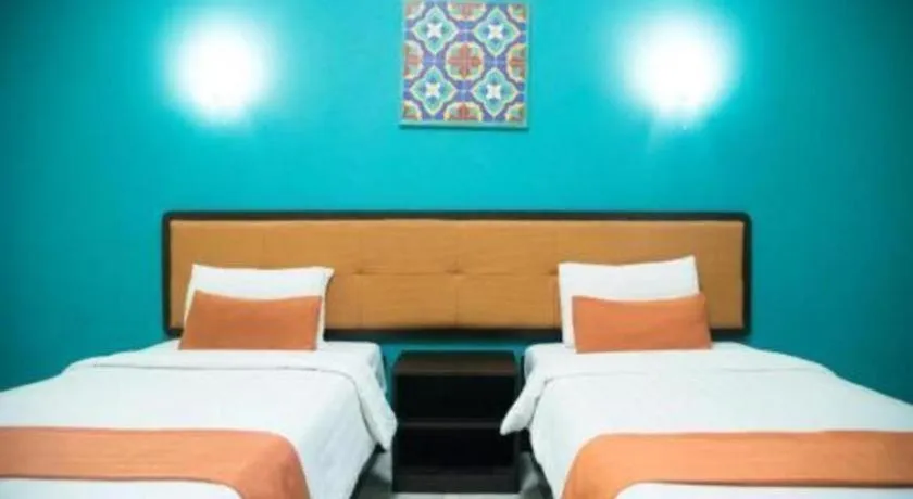 Bed in Ole Suite Hotel