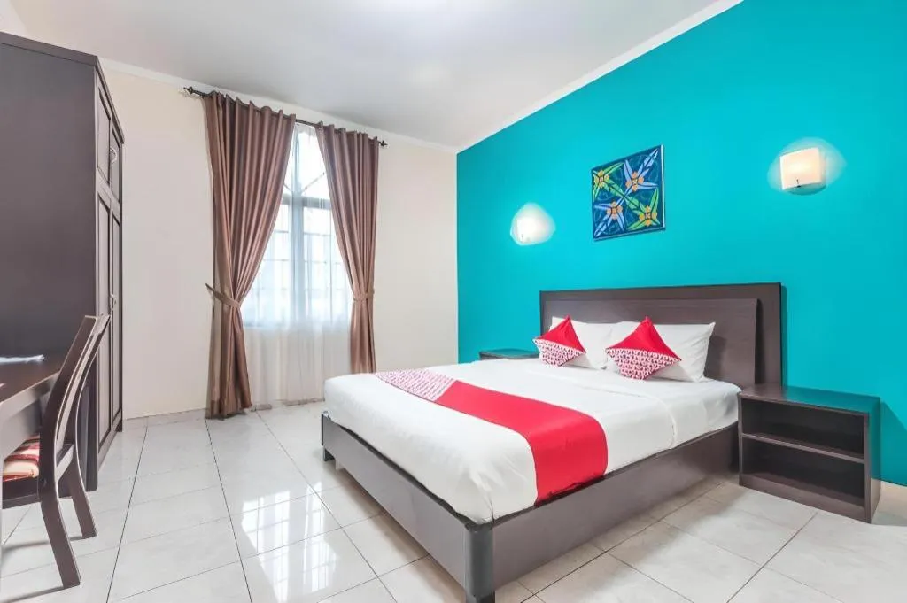 Bed in Ole Suite Hotel