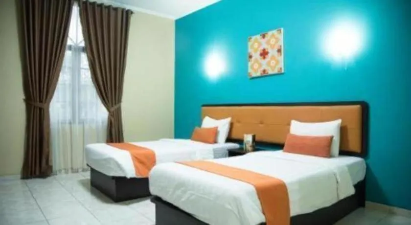 Bed in Ole Suite Hotel