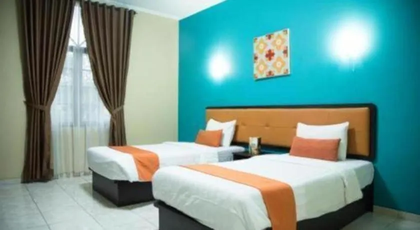 Bed in Ole Suite Hotel