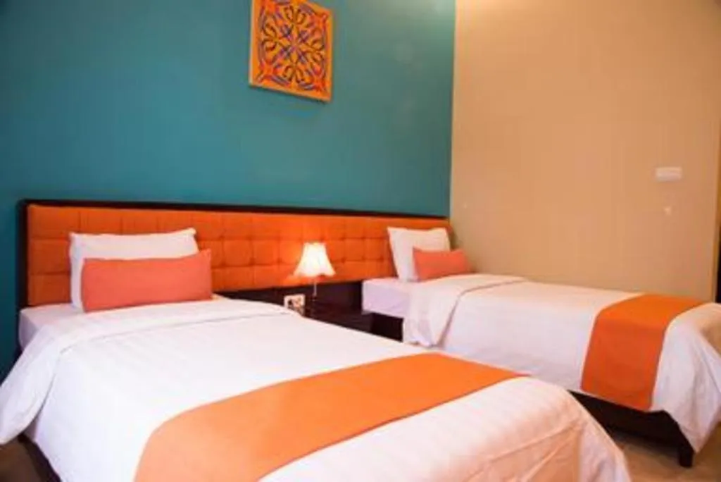 Bed in Ole Suite Hotel